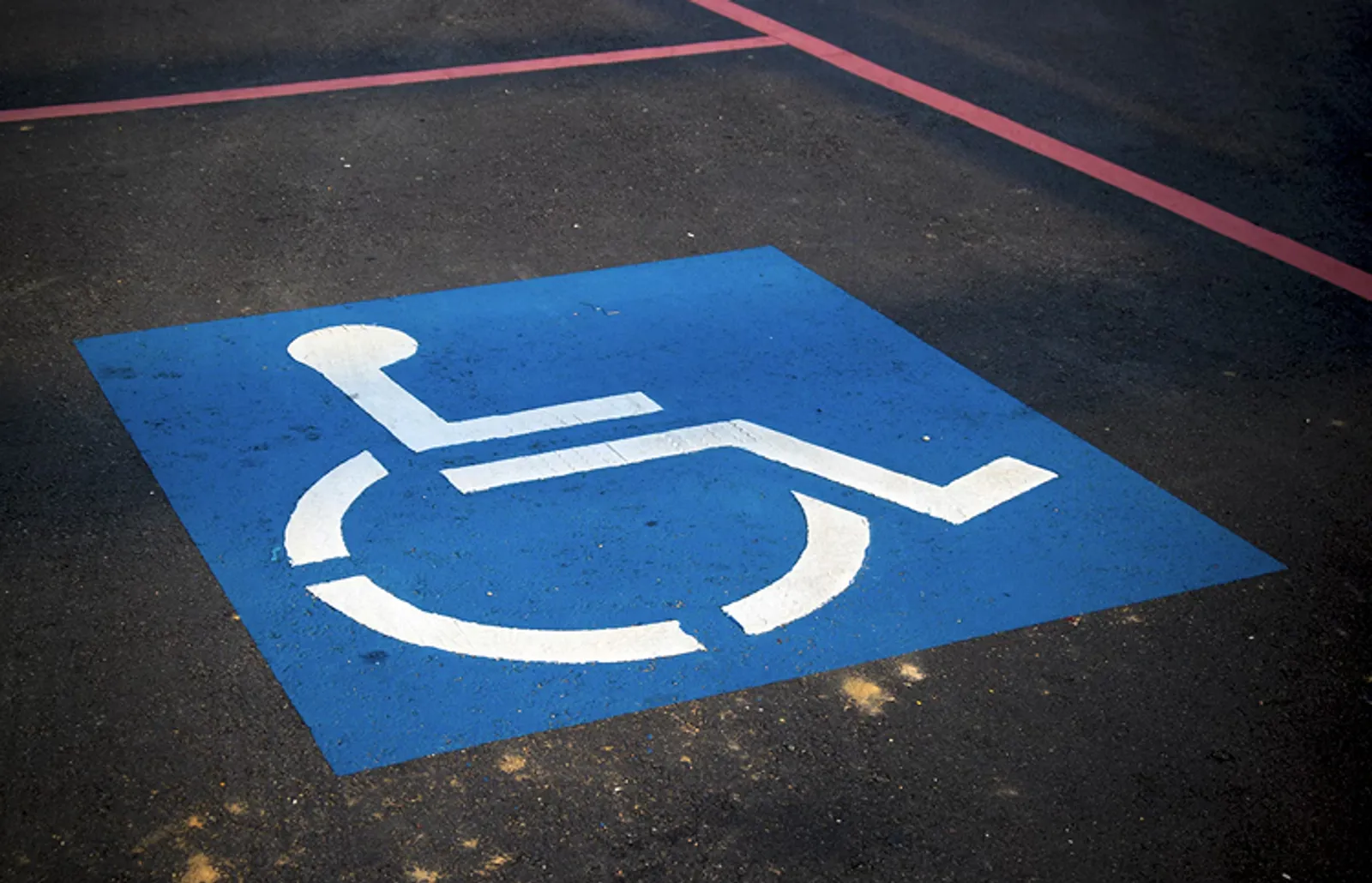 A wheelchair symbol marking an accessible parking space